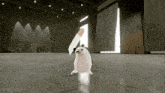 a hamster with a cigarette in its mouth is dancing in a warehouse