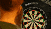 a close up of a dart board that says gran darts on it