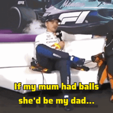 a man sitting on a couch with the words if my mum had balls she 'd be my dad above him