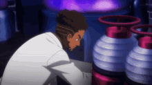 a man in a lab coat looks at a machine with purple lights behind him