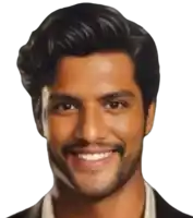 a man with a beard is smiling and wearing a suit jacket