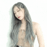 a woman with long grey hair is wearing a headband