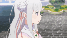 a girl with white hair and a purple eye is standing on a brick sidewalk