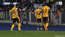 soccer players on a field with a sign that says anca la marina
