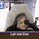 a woman wearing headphones sitting in front of a microphone with the words let me live below her