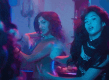 a woman in a black dress is dancing in a room