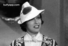 a black and white photo of a woman wearing a hat and saying `` didn t you bring one for me ? ''