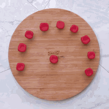 a bowl of chocolate is being poured into a cake pan