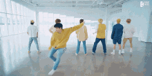 a group of men are dancing in a room with eight music written on the bottom