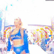 a cheerleader wearing a blue fabulous top and shorts