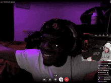 a man wearing headphones and a hat with a srn logo on it