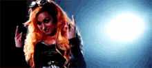 a woman with red hair is making a middle finger sign