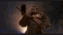 kong finds battle axe and roars gif