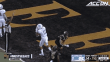 a football game is being played between wake forest and north carolina