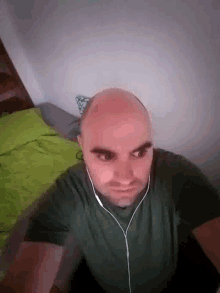 Bald Looking GIF - Bald Looking Earphones GIFs