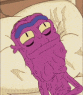 a purple cartoon character is laying on a pillow with the letter g below him