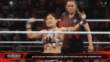 a woman in a wrestling ring with the headline aj styles del finn balor after penta neutralizes the judgment day