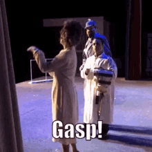 a group of people standing on a stage with the word gasp written on the bottom