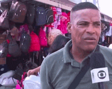 a man is talking into a microphone with the letter o on it .