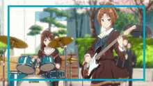 a girl is playing a guitar in front of a drum set that says yamaha
