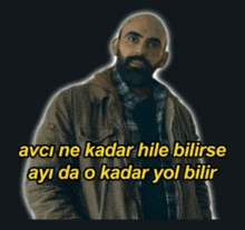 a bald man with a beard stands in front of a black background with the words avci ne kadar hile bilirse ayi da