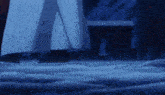 a person 's feet are shown in the snow with a building in the background