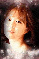 a close up of a woman 's face with hearts floating around her