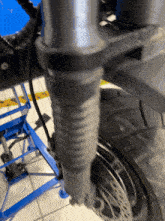 a close up of a motorcycle 's front fork and brake disc
