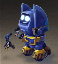 a blue and yellow robot with a claw on its arm .