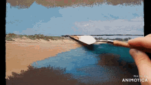 a person is painting a beach scene with the words made in animotica below