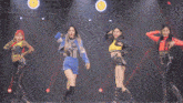 a group of young women are dancing on a stage with a watermark that says ' sbs ' on it