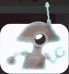 a cartoon robot with antennas is sitting on a white table .