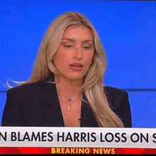 a woman on a news channel with a banner that says " n blames harris loss on s "