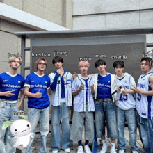 a group of young men wearing chung-an university shirts