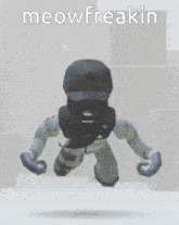 a robot wearing a mask and gloves with the words meowfreakin on the bottom