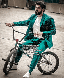 a man in a suit is riding a bike with a nice saturday message