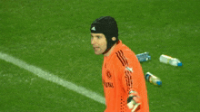 a soccer player wearing a helmet with the number 1 on his jersey