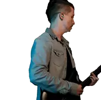 a man wearing ear buds is playing a guitar