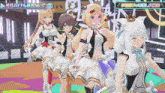 a group of anime girls are standing next to each other on a stage .