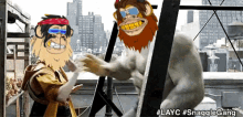 a cartoon of two monkeys shaking hands with the hashtag #layc