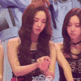 a girl with a bracelet on her wrist that says dani on it