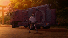 a girl stands in front of a fire truck with a hose attached to it