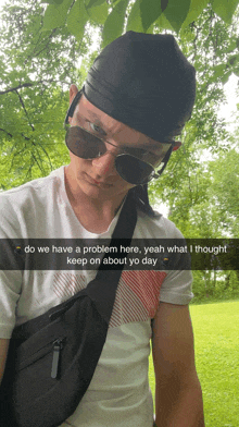 a man wearing sunglasses and a bandana says " do we have a problem here "