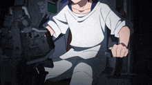a person in a white shirt sitting in a chair