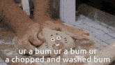 a person kneading dough with a cartoon face on it