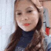 a close up of a woman 's face with tiktok written on the bottom right