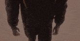 a close up of a person 's back with a backpack on their back .