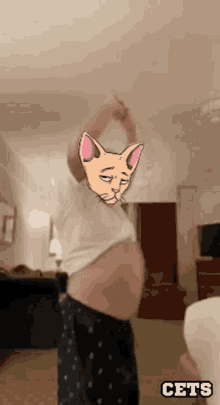 a person with a cat face on their chest and the word cets below them