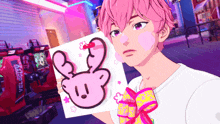 a boy with pink hair is holding a piece of paper with a pink rabbit on it