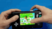 a person is playing a video game on a black device